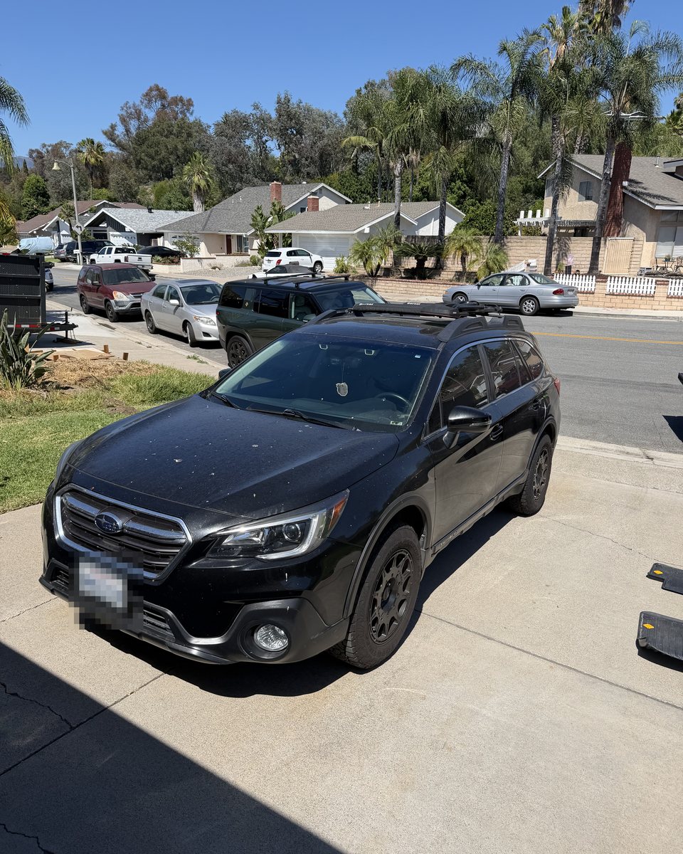 The same Outback before detailing, covered in droppings and dust